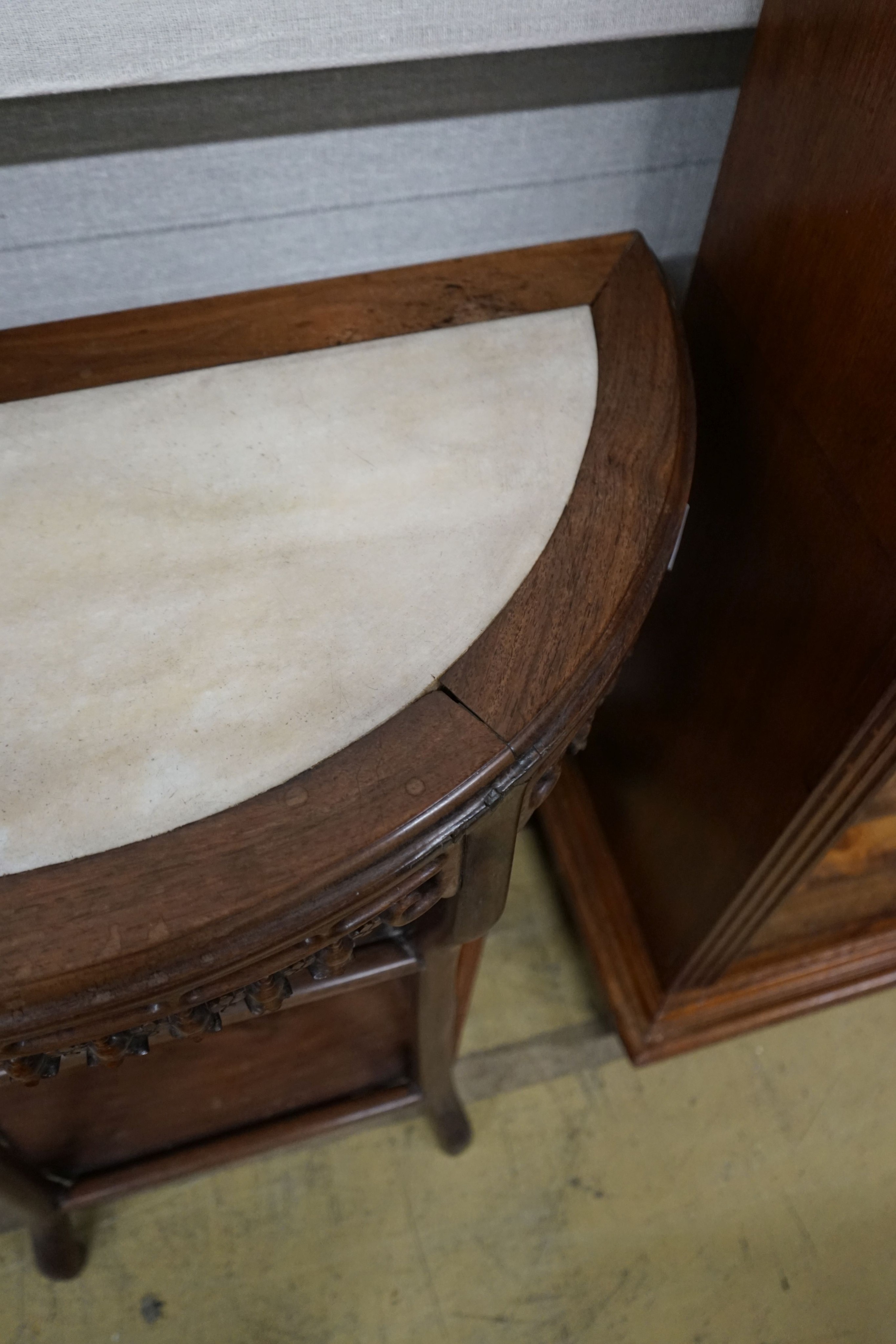 A pair of Chinese marble-topped demi lune console tables, width 82cm, depth 40cm, height 80cm